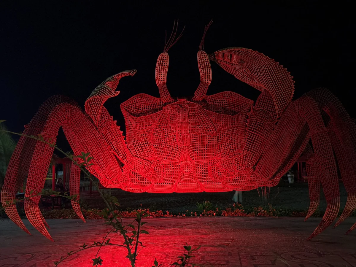Large public sculpture lit at night
