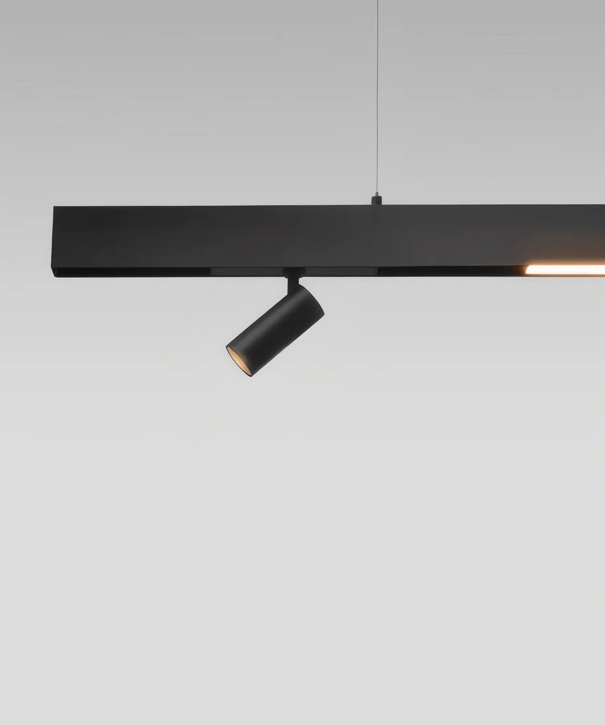 Suspended magnetic track on wires with a linear up-light and a spot below