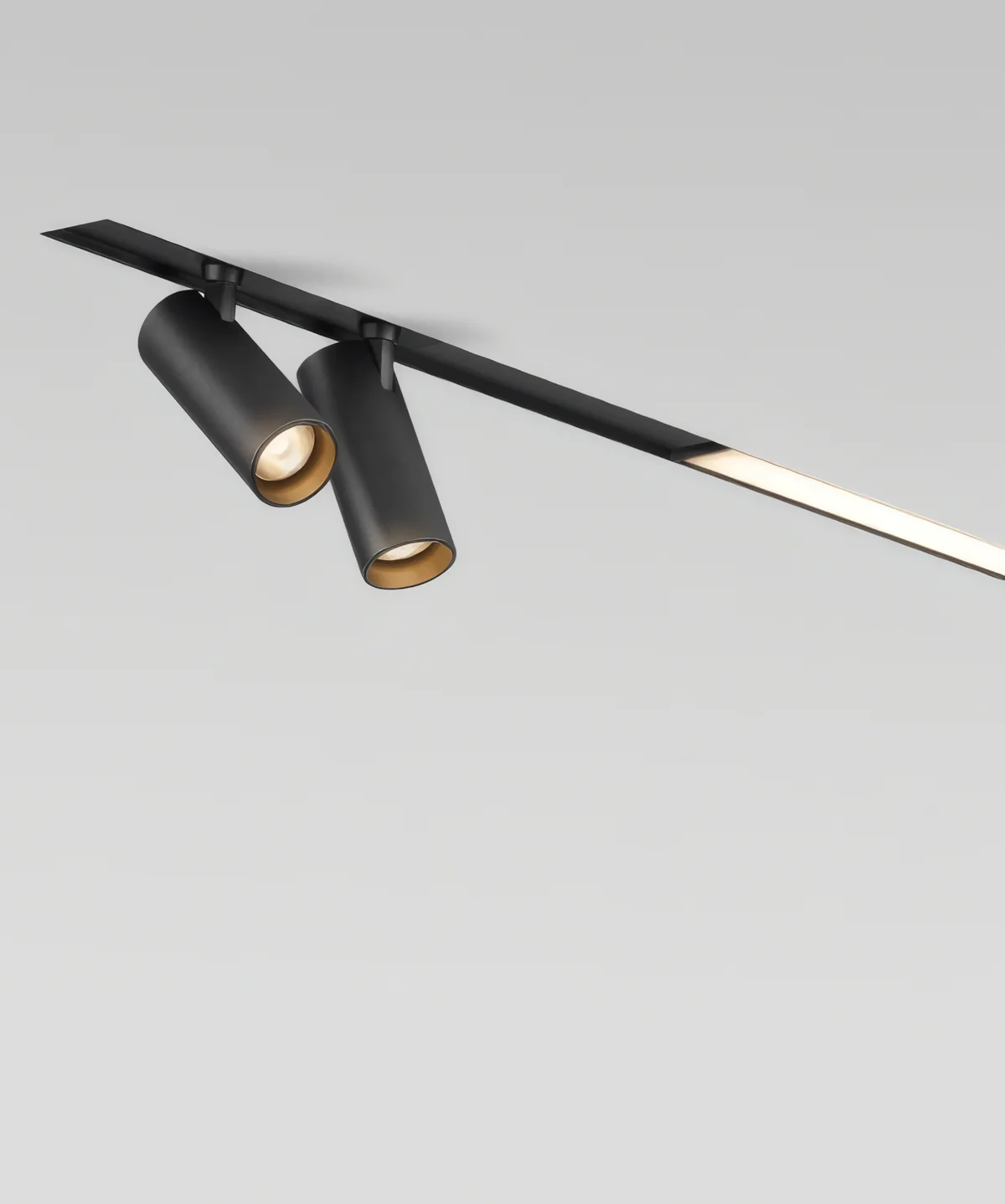 Magnetic track recessed flush into a ceiling with two spots and a linear light